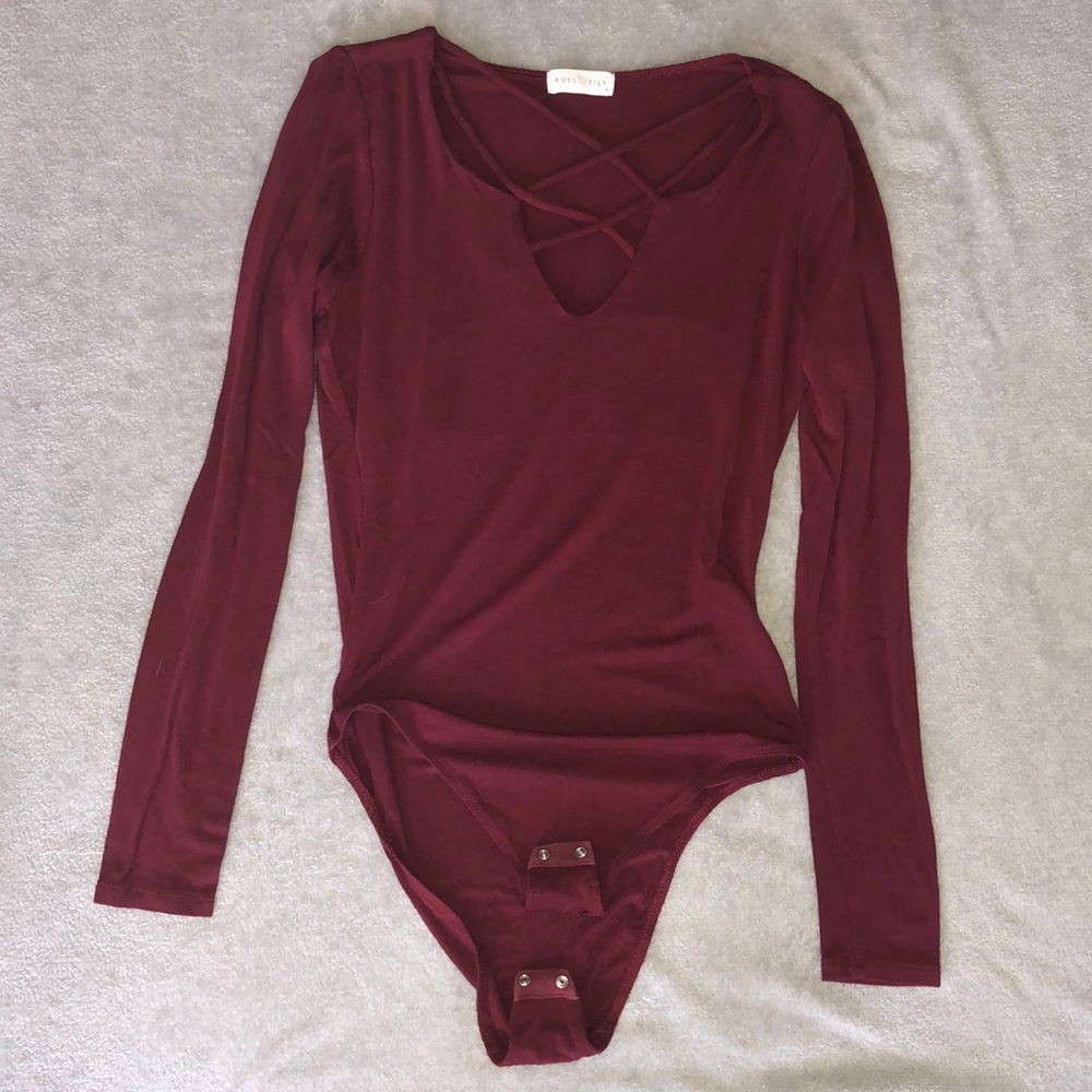 Full Tilt Long sleeve one piece. Buttons on bottom